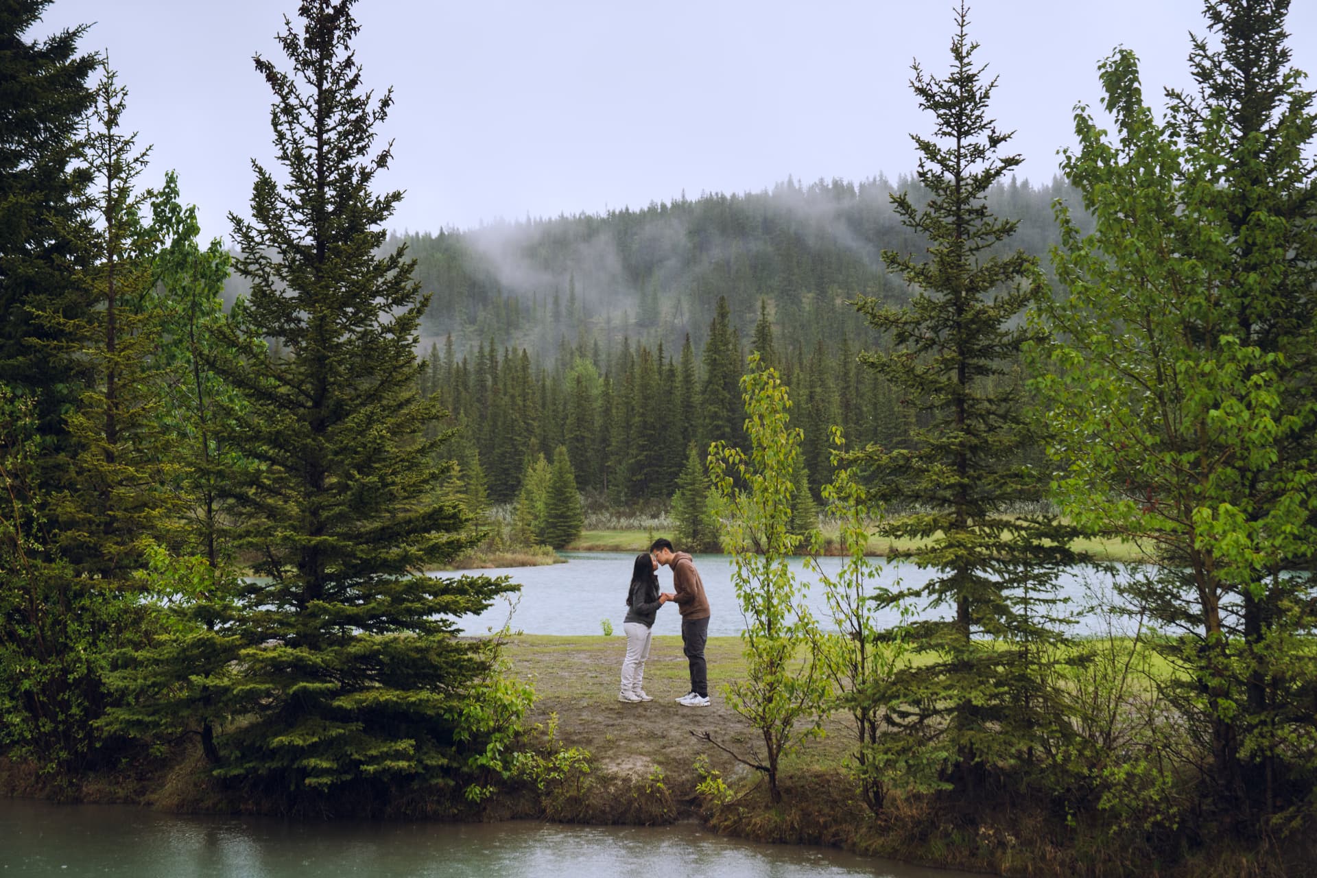 Andrea and Dannison by a misty forest lake